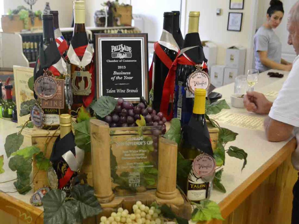 Talon Winery's display reveals the competitive nature of the wine scene in Palisade.