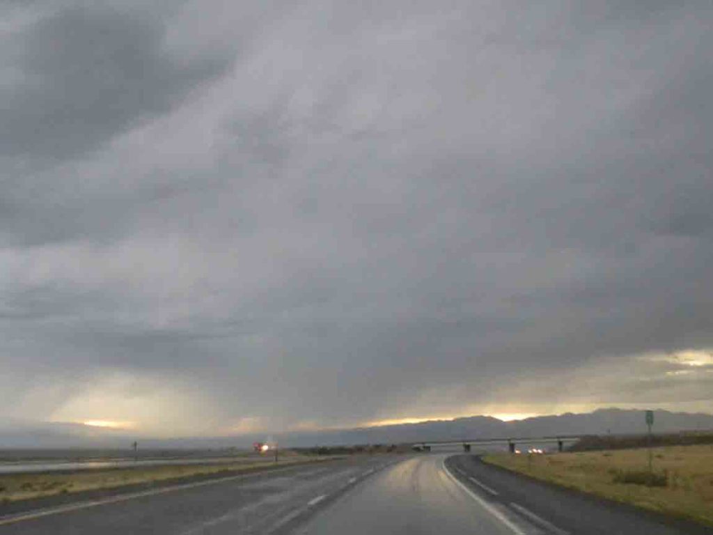 The road ahead partially shrouded in rain.