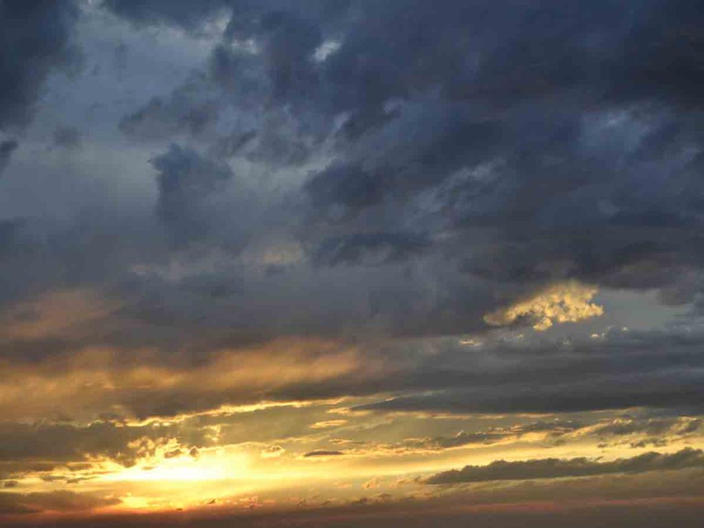 Behind the storm, a dramatic sunset peeked through.