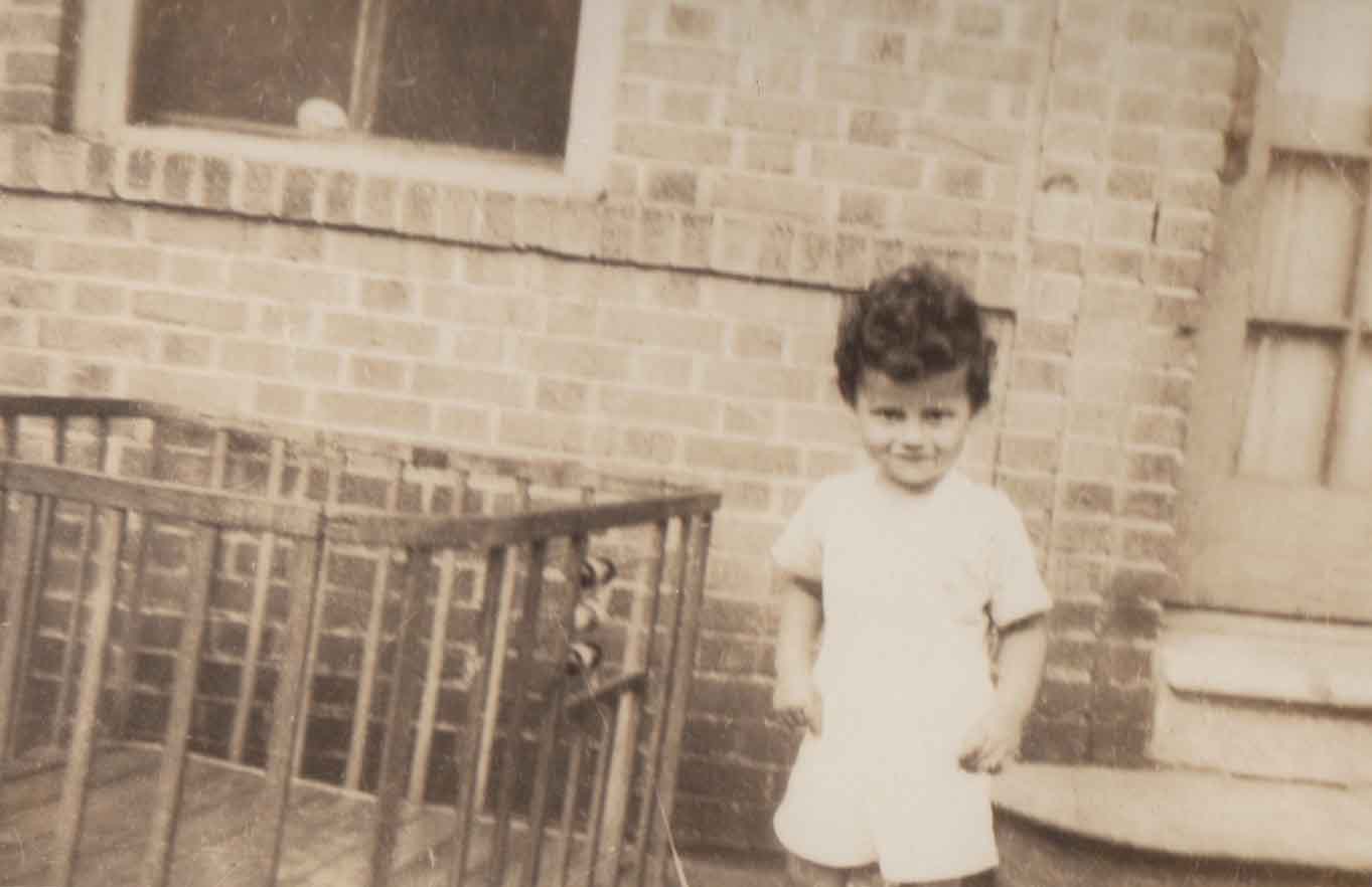 Few photos exist of Mason and Jon during their early days in Florida. Here, Mason stands next to Jon's crib outside the Loika's Bronx apartment building.