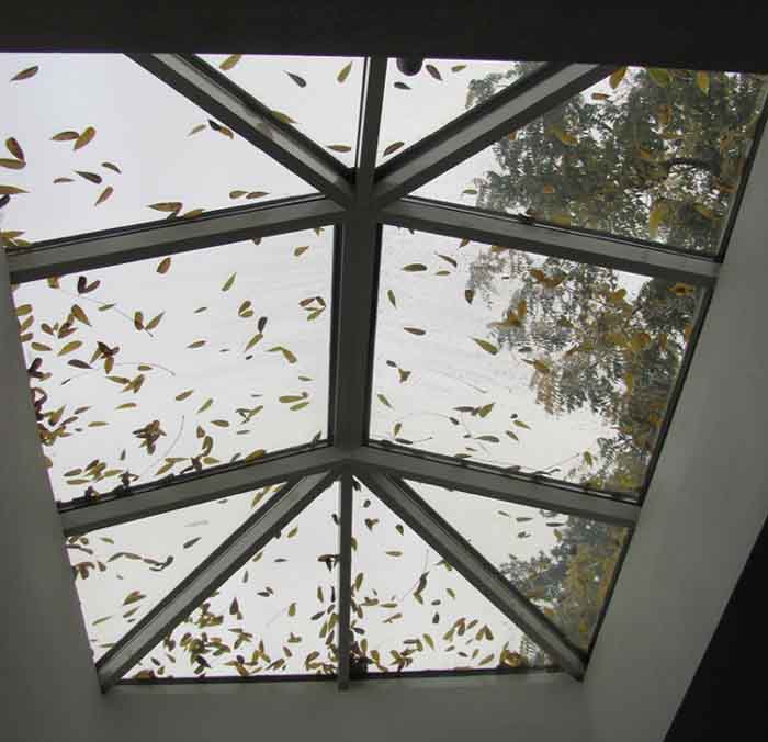 Fallen leaves on the Multnomah Friends' Meetinghouse skylight remind Quakers about changing of the seasons.