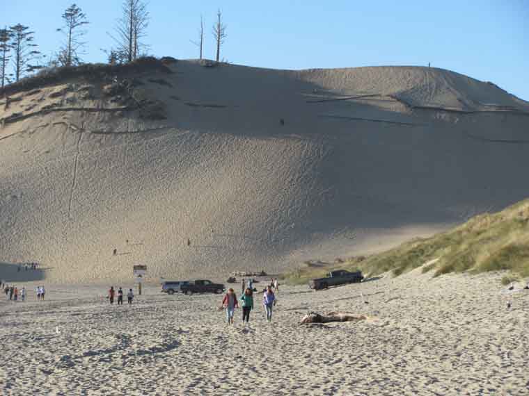 A six-story sand dune offers a picturesque view of Cape Kiwanda's surrounding area.